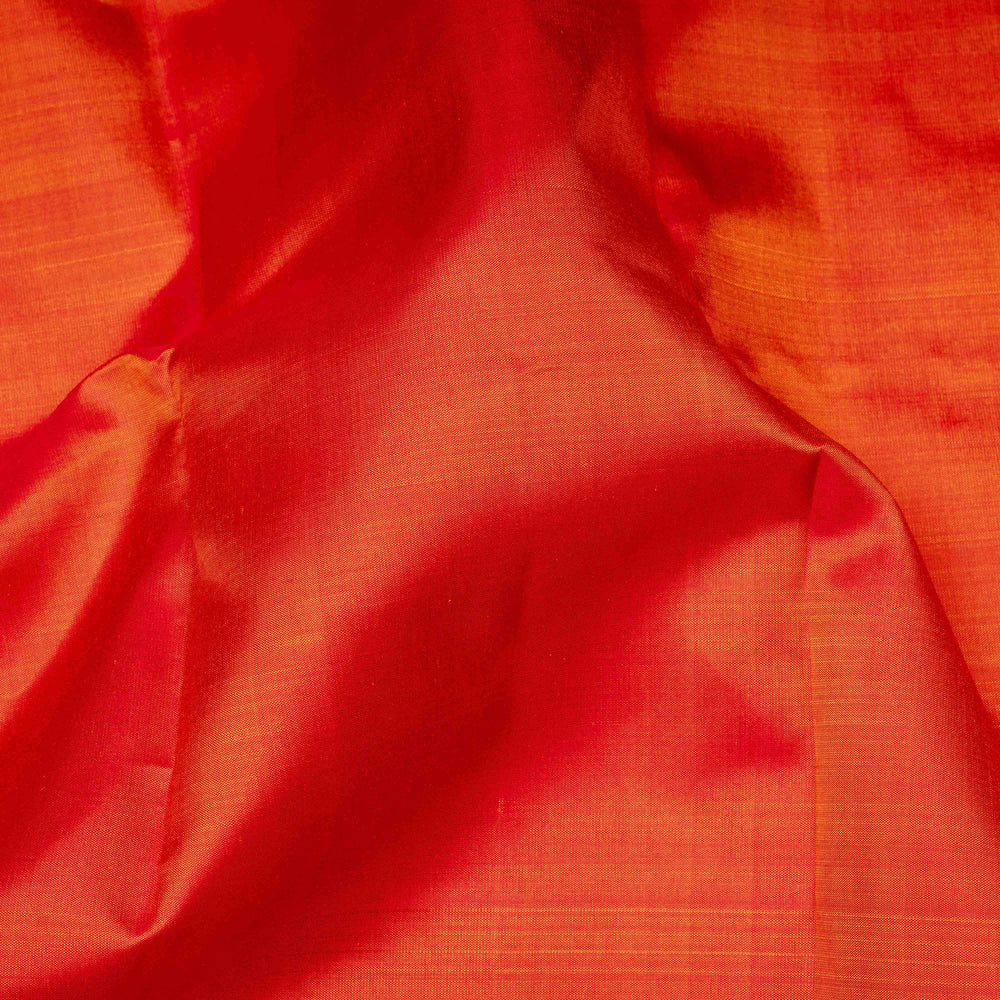 Close-up of red and orange fabric with a textured pattern