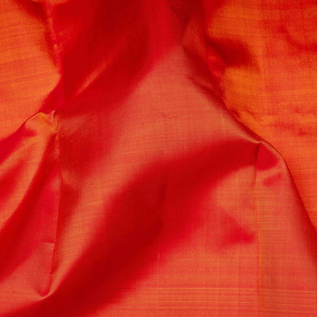 Close-up of red and orange fabric with a textured pattern