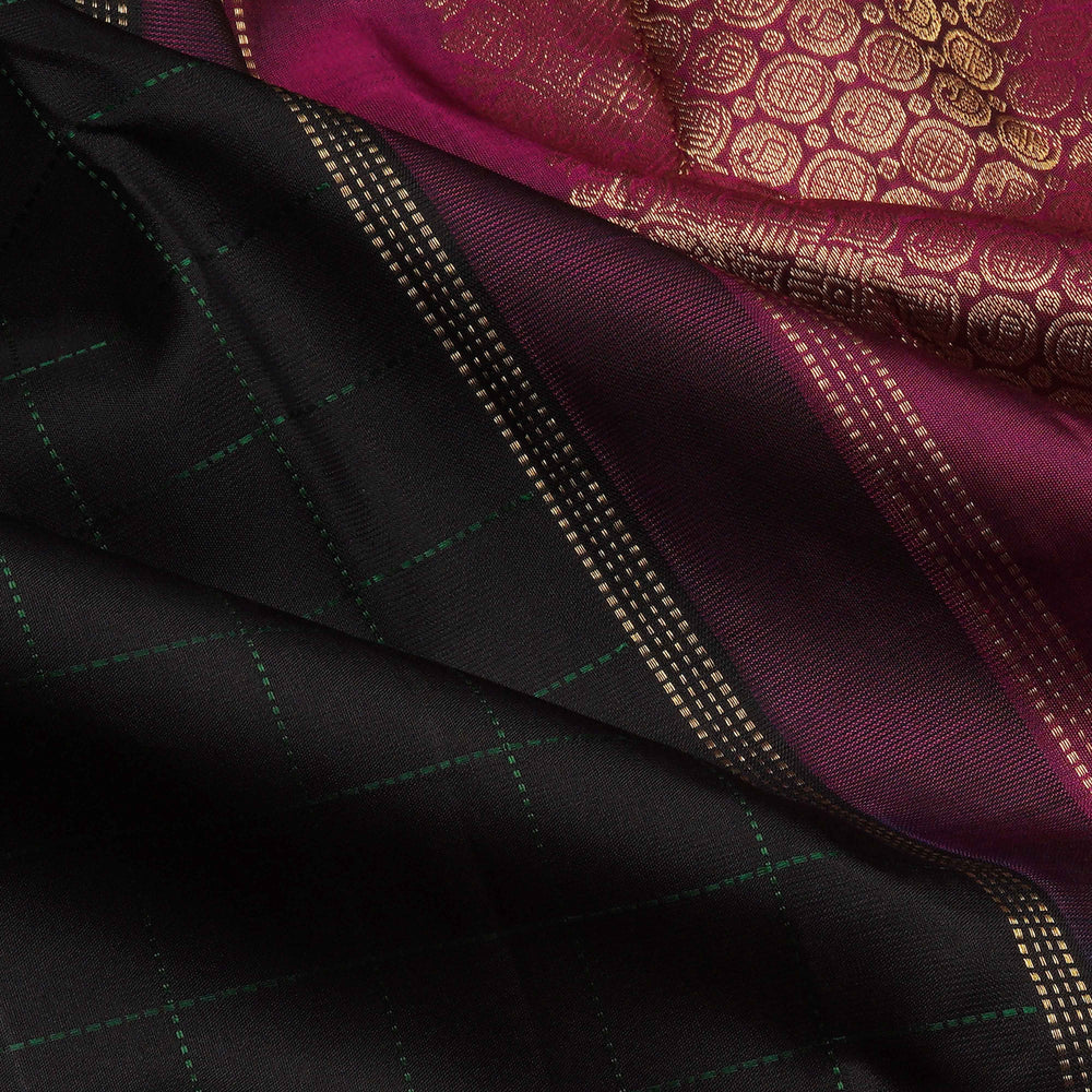 Close-up of black and maroon fabric with intricate patterns