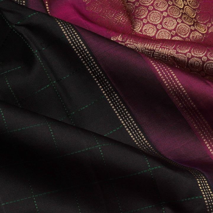 Close-up of black and maroon fabric with intricate patterns