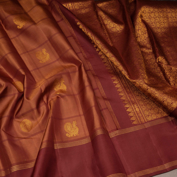 Brown fabric with gold embroidery and patterns