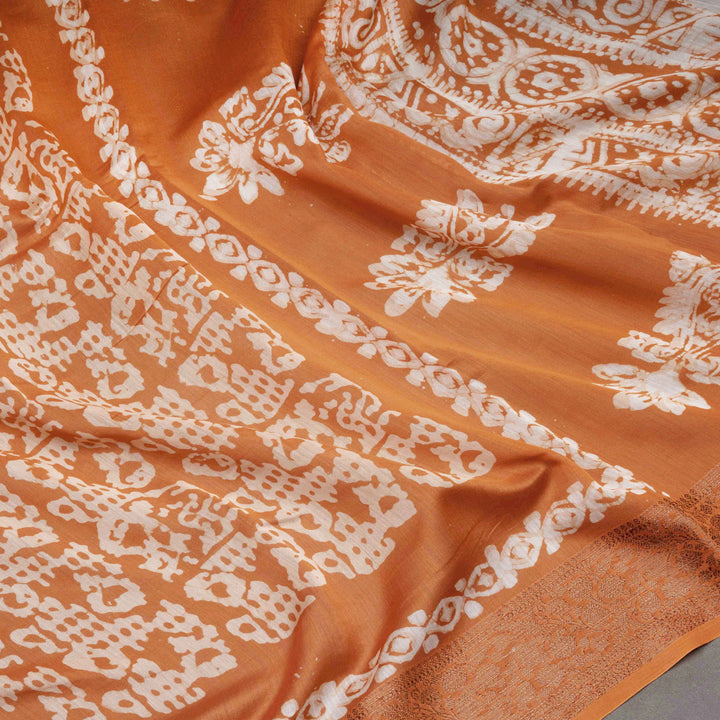 Orange fabric with white intricate patterns