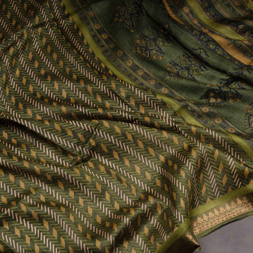 Close-up of a green patterned fabric with intricate designs.