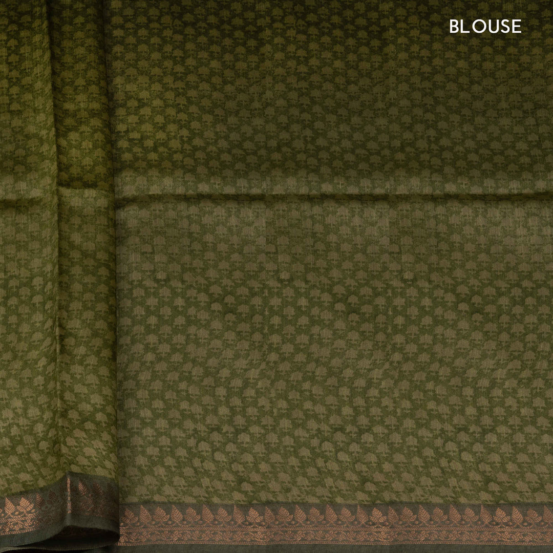 Close-up of green fabric with a subtle pattern, labeled 'BLOUSE'.