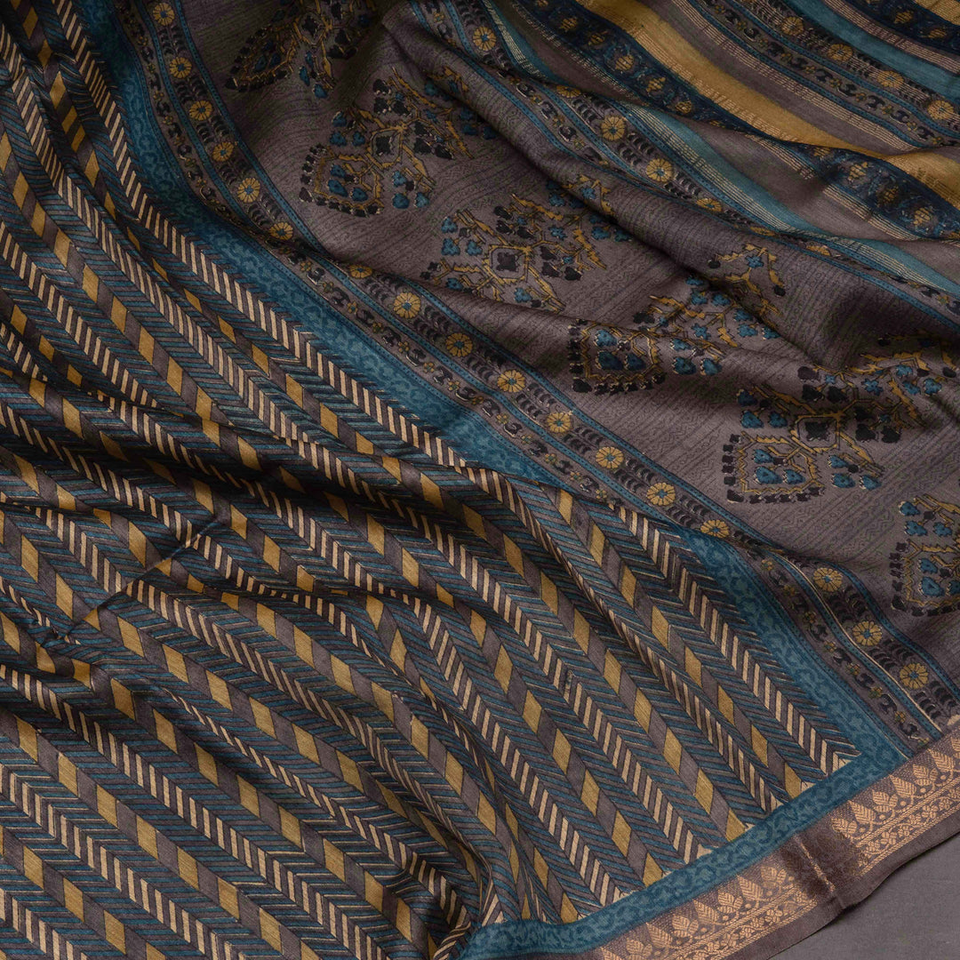 Close-up of a patterned fabric with geometric and floral designs.