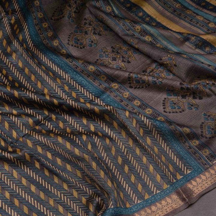 Close-up of a patterned fabric with geometric and floral designs.