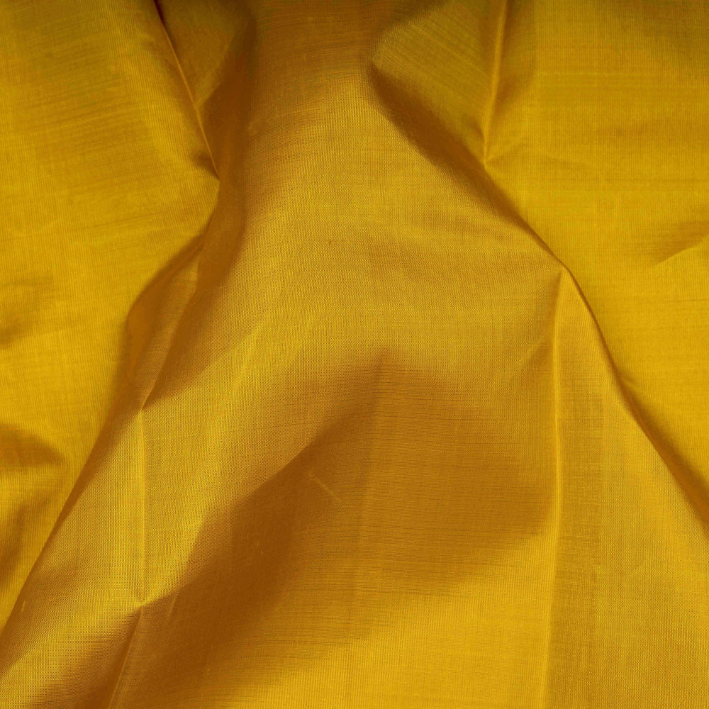 Close-up of yellow fabric with a textured pattern