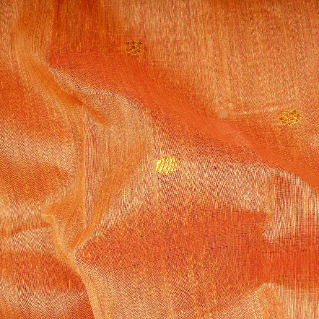 Close-up of orange fabric with subtle patterns
