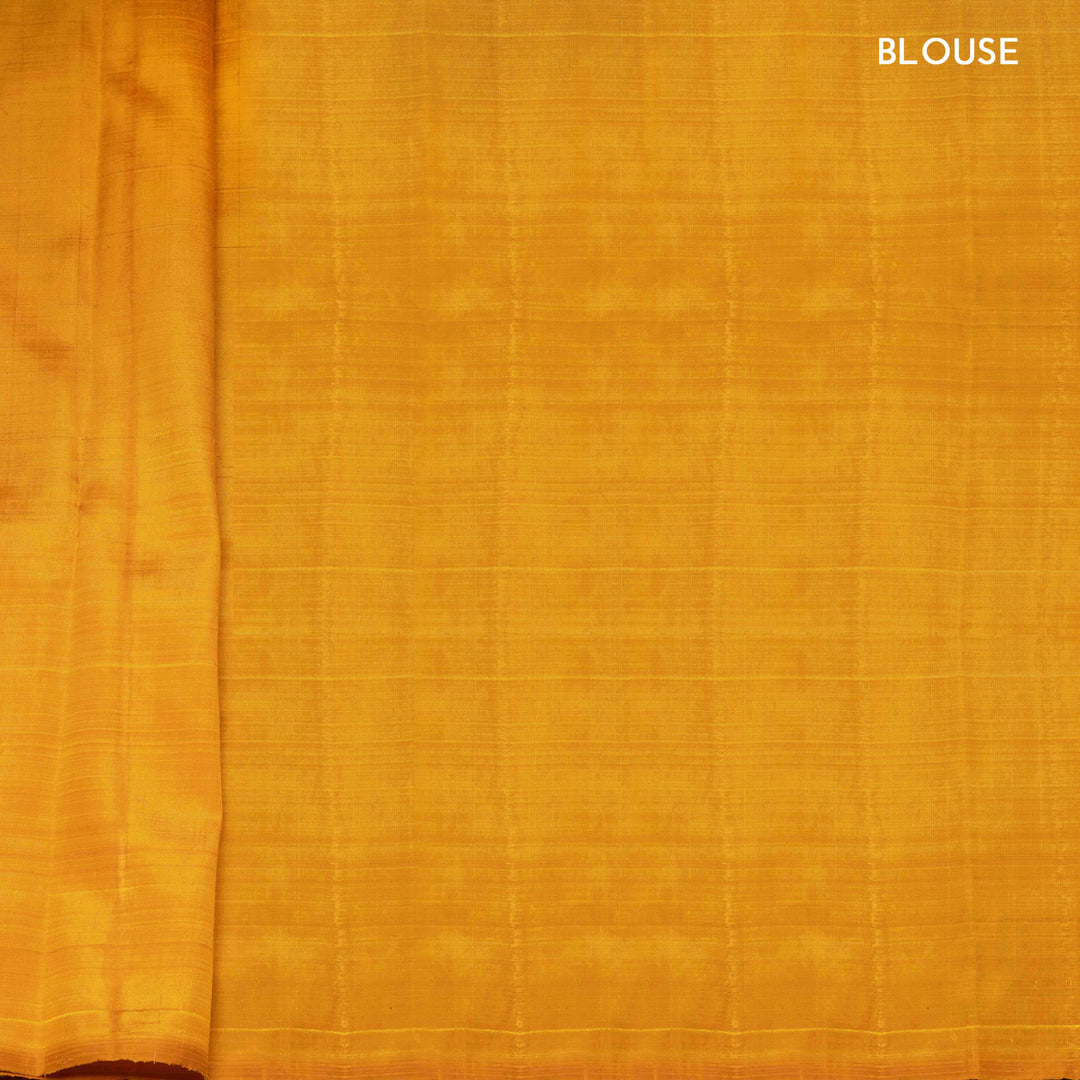 Close-up of yellow fabric with 'BLOUSE' text