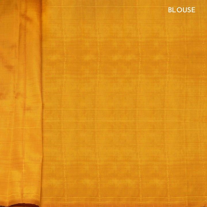 Close-up of yellow fabric with 'BLOUSE' text