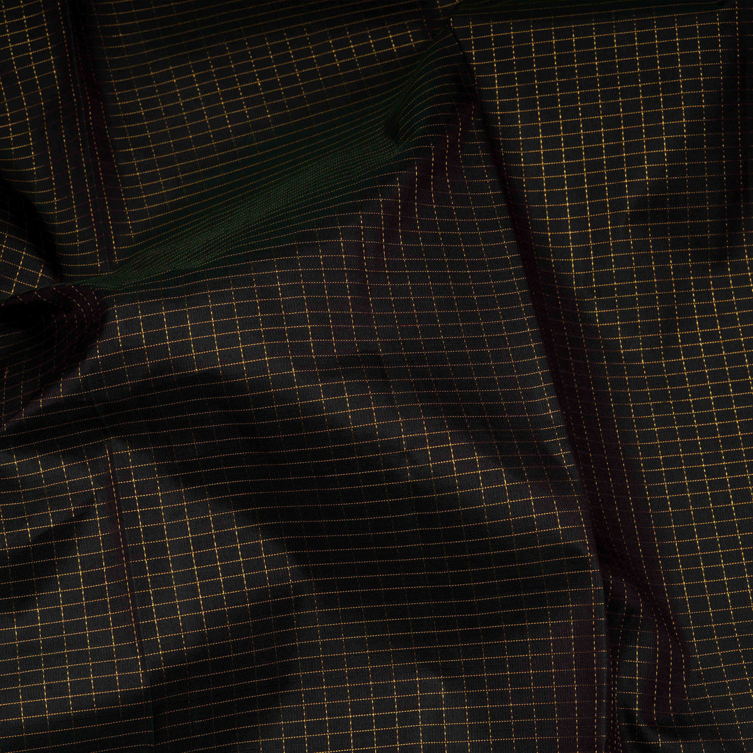 Closeup of Handwoven Checks & Stripes Kanjivaram silk saree in black and magenta color