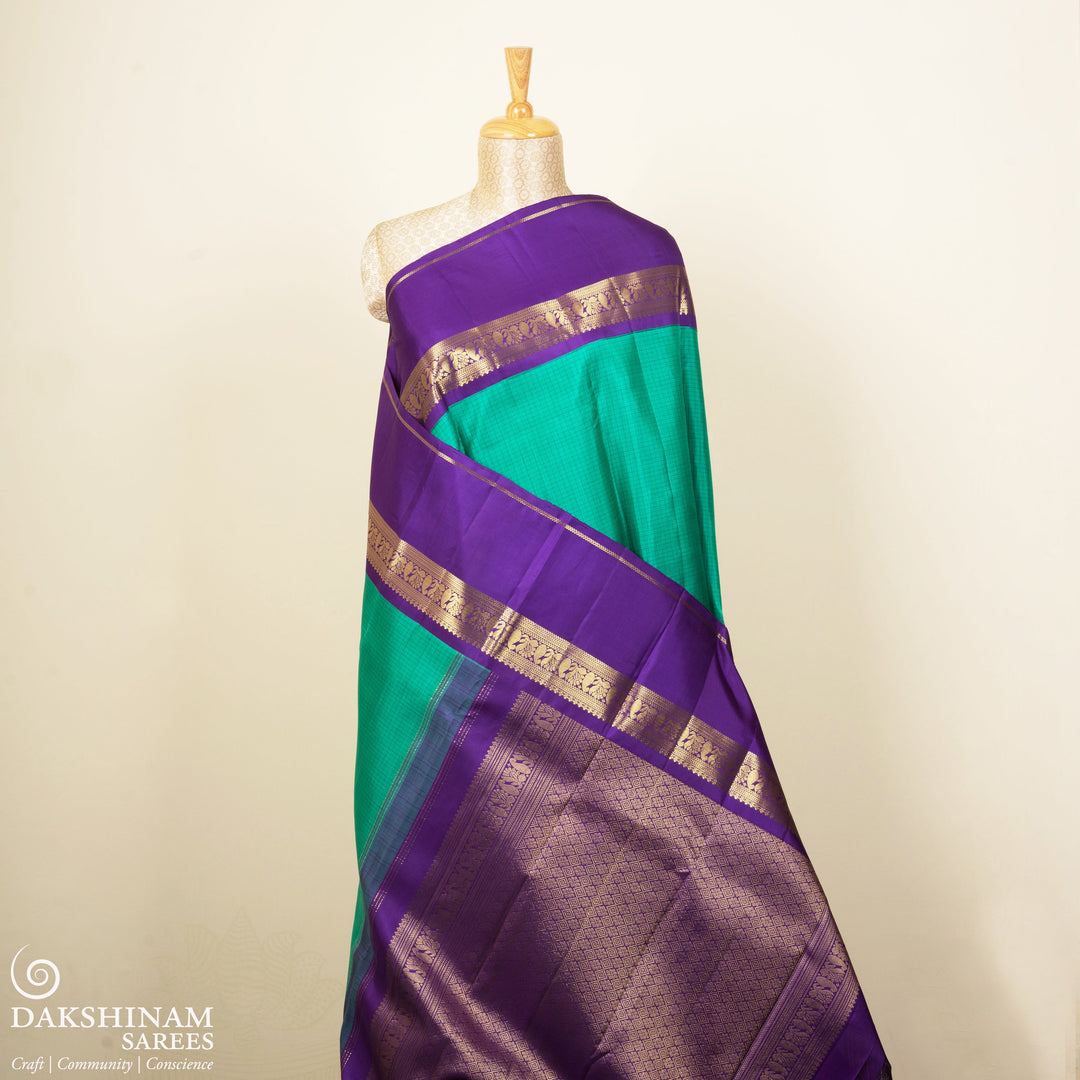 Pleats/body  of Handwoven Checked Korvai Kanjivaram silk saree in Teal Green and Purple color