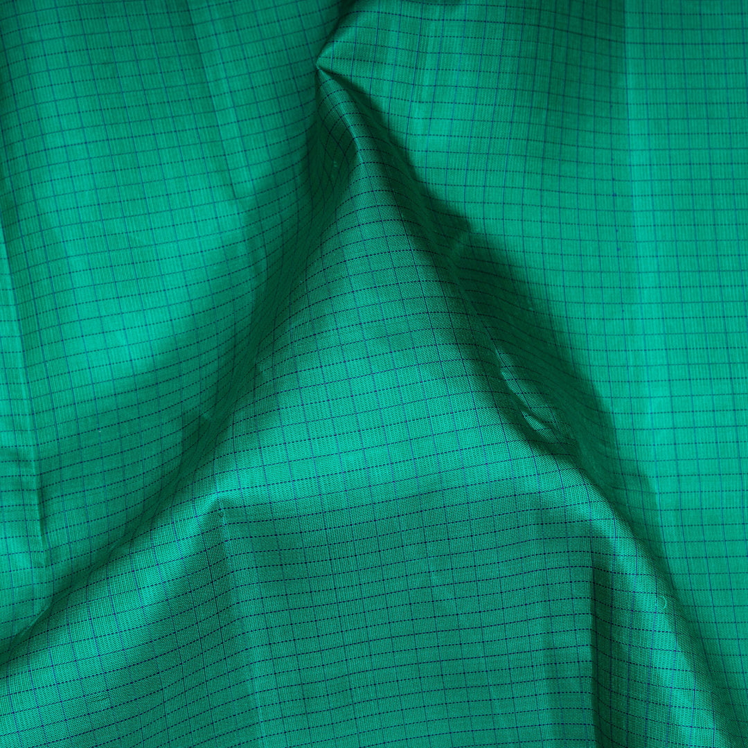 Closep of Handwoven Checked Korvai Kanjivaram silk saree in Teal Green and Purple color