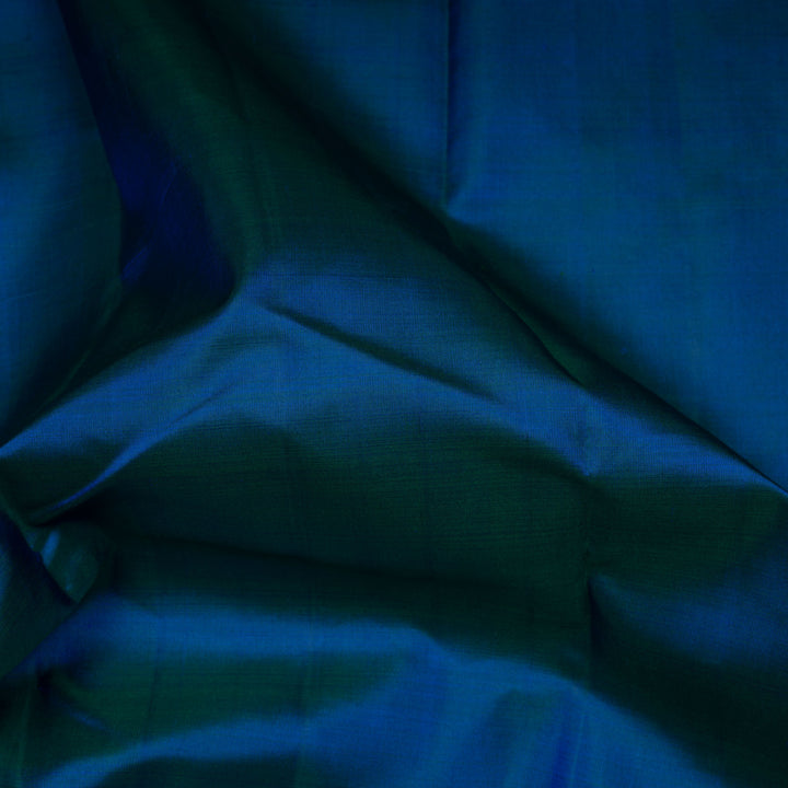 Close-up of blue fabric with folds