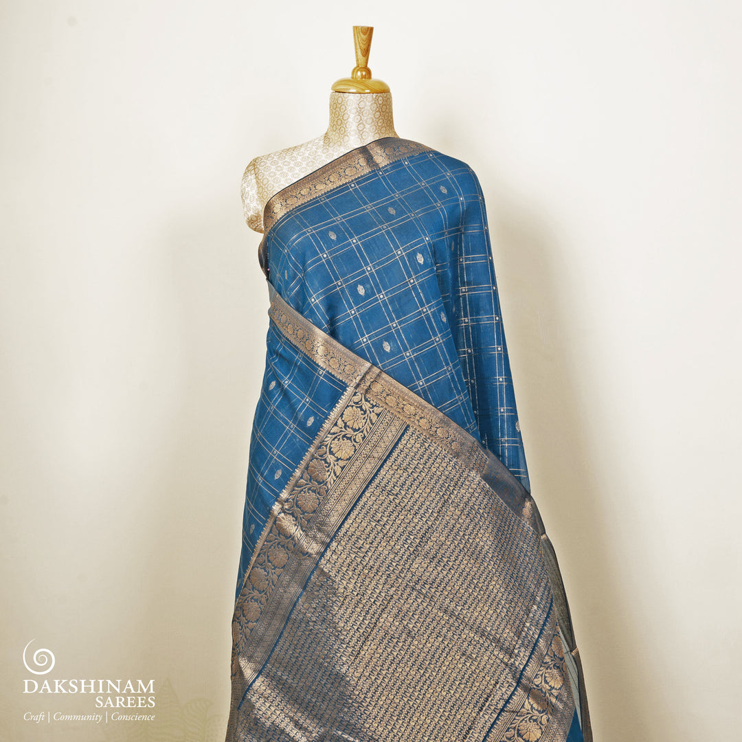 Blue checked silk cotton saree with gold zari border featuring leaf motifs and dotted check pattern