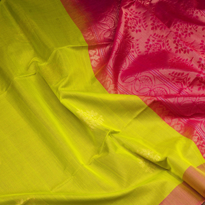 Lime green silk cotton saree with tree of life motifs, rust orange border and magenta pallu with zari detailing