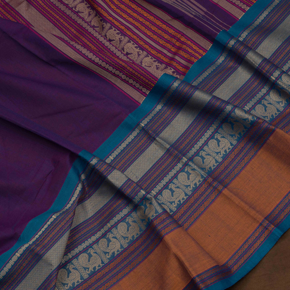 Purple Kanchi cotton saree with plain body, mango design border, mayil butta and traditional pallu with matching blouse