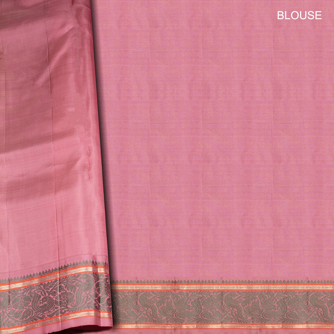 Orange Kanjivaram silk saree with floral butta, pink annam border and traditional pallu with matching blouse