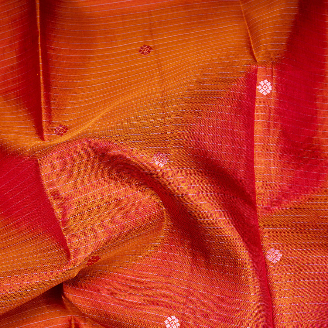 Orange Kanjivaram silk saree with floral butta, pink annam border and traditional pallu with matching blouse