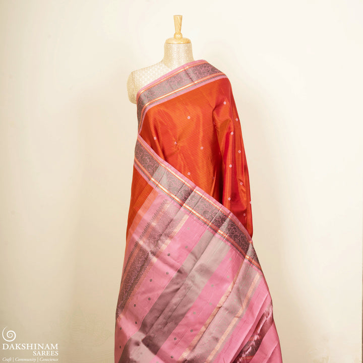 Orange Kanjivaram Silk Saree with Floral Butta and Pink Border