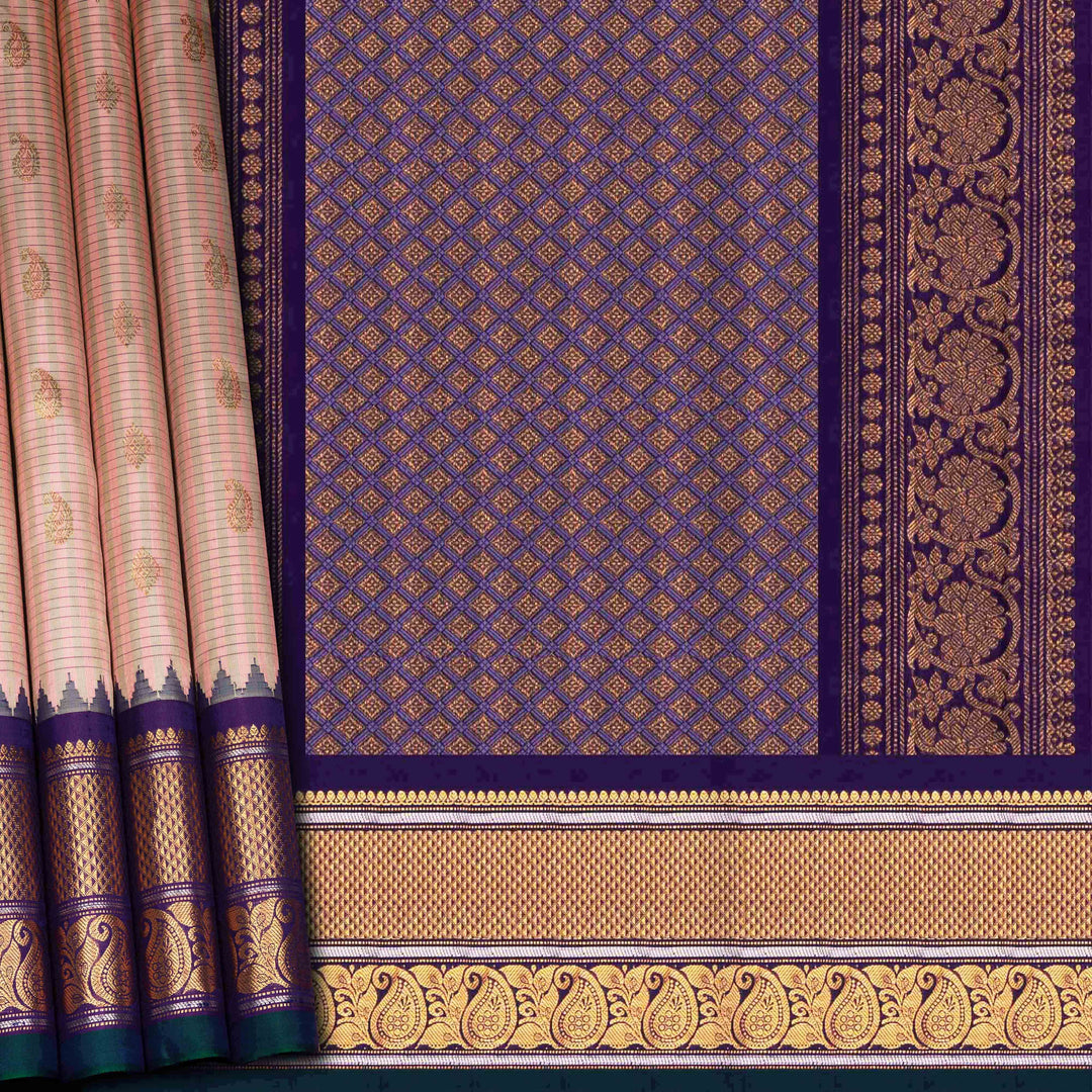 Peach Gadwal silk saree with grey checks and small butta body, purple zari border with mango and leaf motifs, plain purple blouse.
