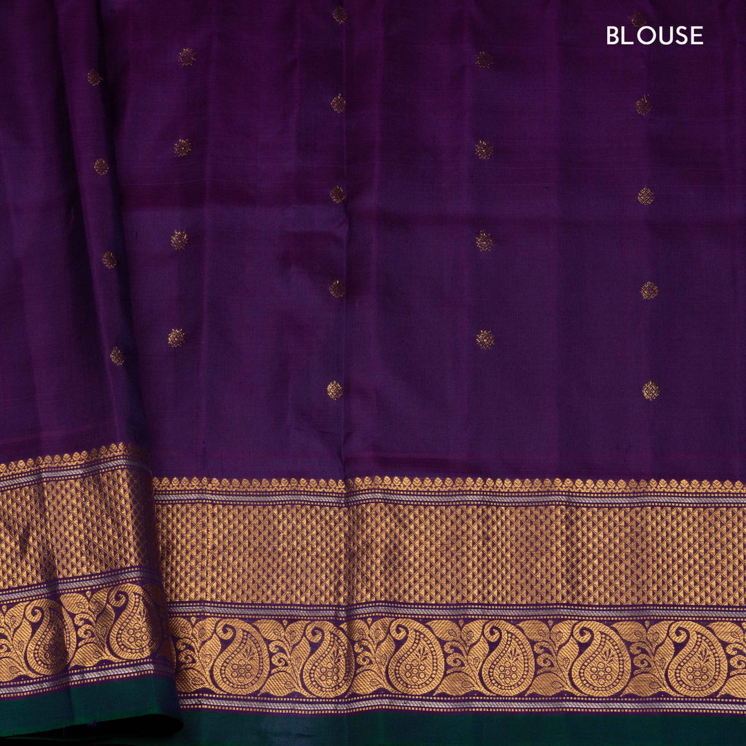 Peach Gadwal silk saree with grey checks and small butta body, purple zari border with mango and leaf motifs, plain purple blouse.