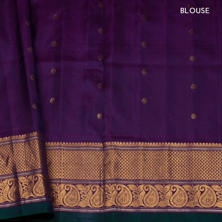 Peach Gadwal silk saree with grey checks and small butta body, purple zari border with mango and leaf motifs, plain purple blouse.