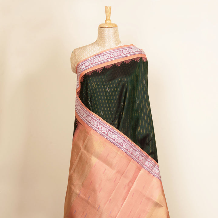 Bottle green Gadwal silk saree with gold zari stripes, peach border and temple design pallu