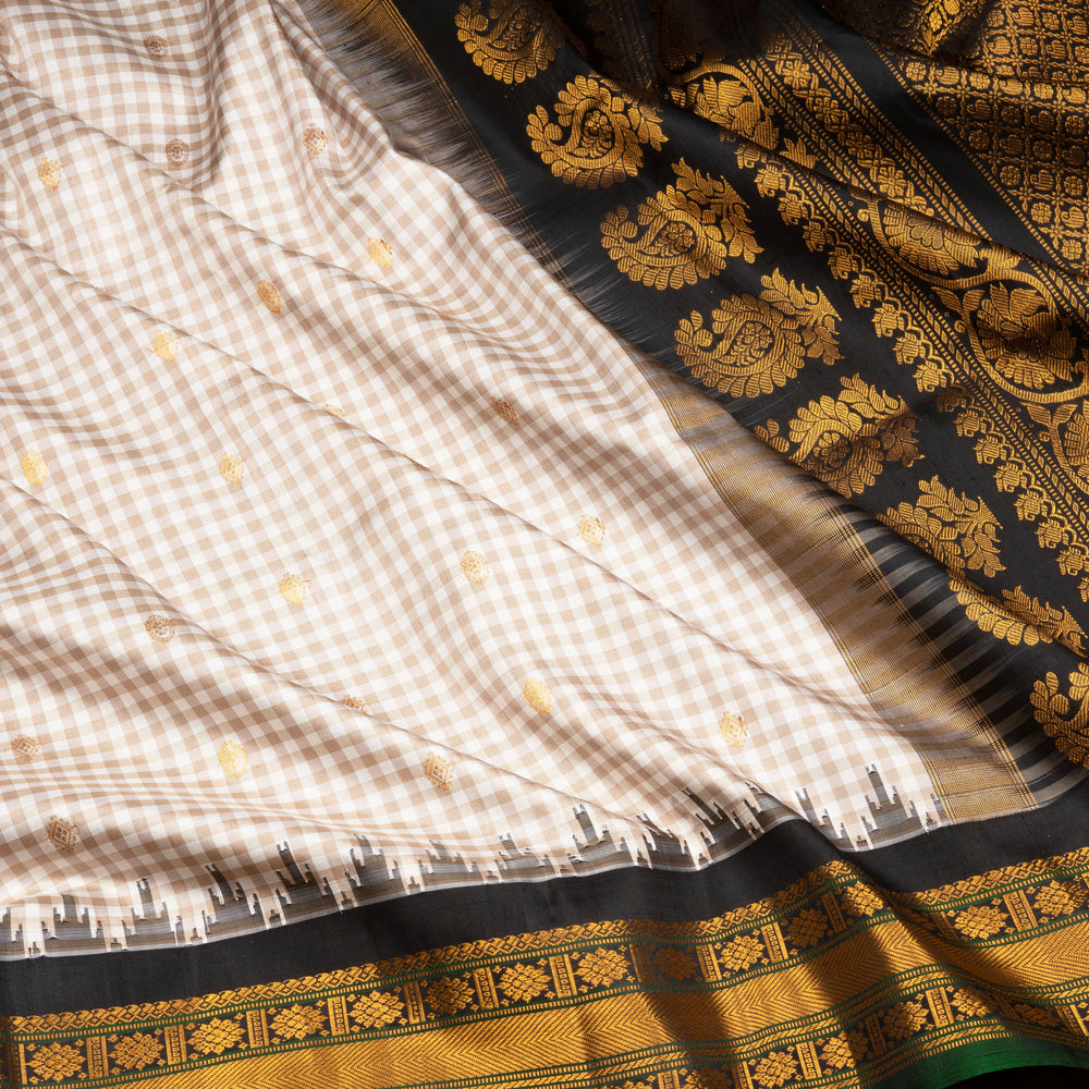 Off white Gadwal silk saree with small checks, dark green border and gold zari traditional motifs