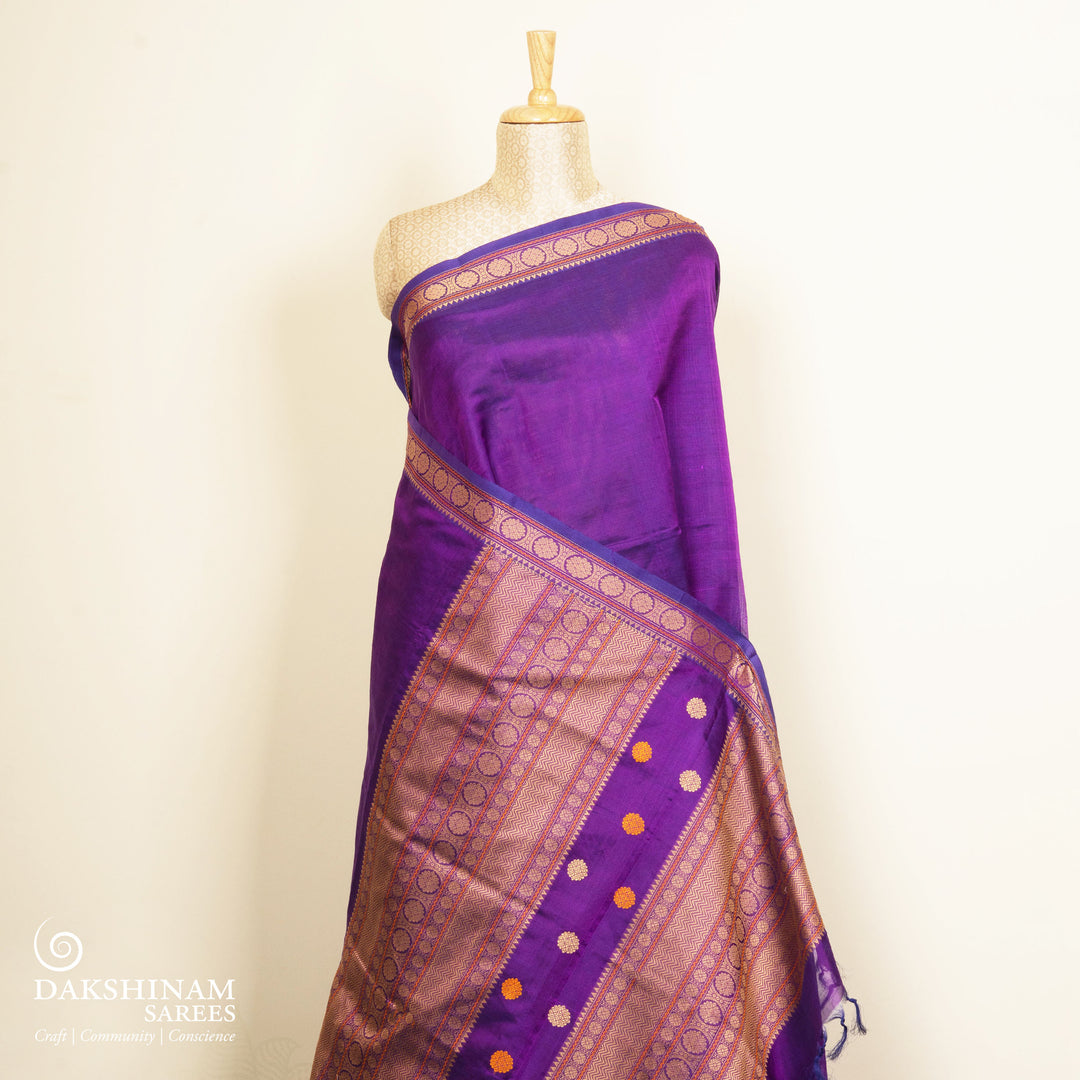 Plain violet silk cotton saree with thread woven rudraksham border and temple chakra pallu design
