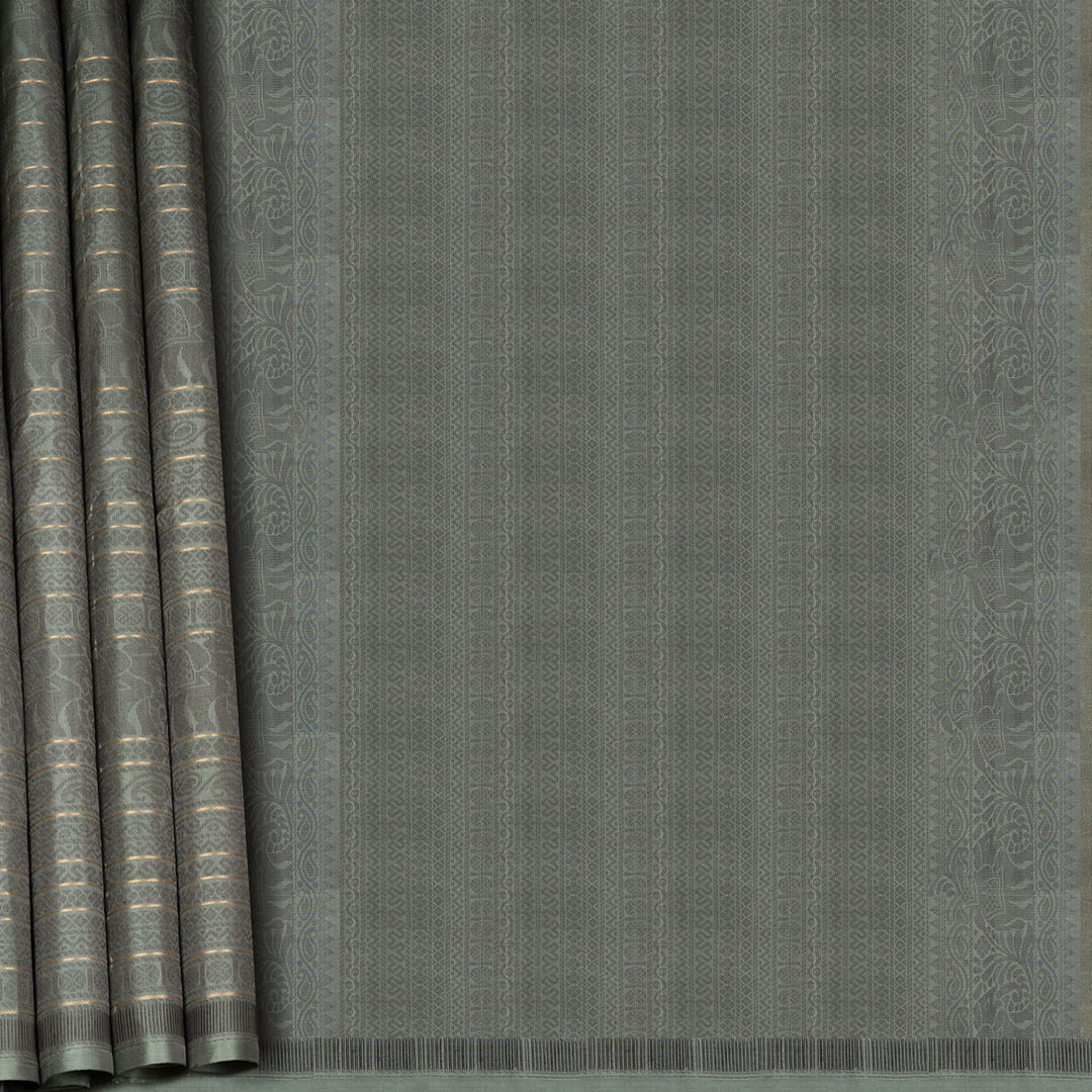 Grey soft silk saree with multithread motifs like elephant, rudraksham, chevron, diamond and mango patterns with matching pallu and plain blouse.