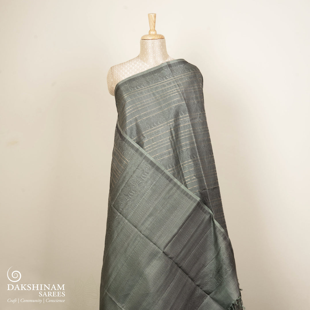 Grey soft silk saree with multithread motifs like elephant, rudraksham, chevron, diamond and mango patterns with matching pallu and plain blouse.