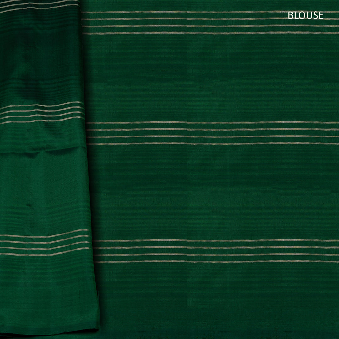 Green soft silk saree with lime yellow stripe and dash threadwork and silver zari lines, paired with a plain blouse with zari detailing.