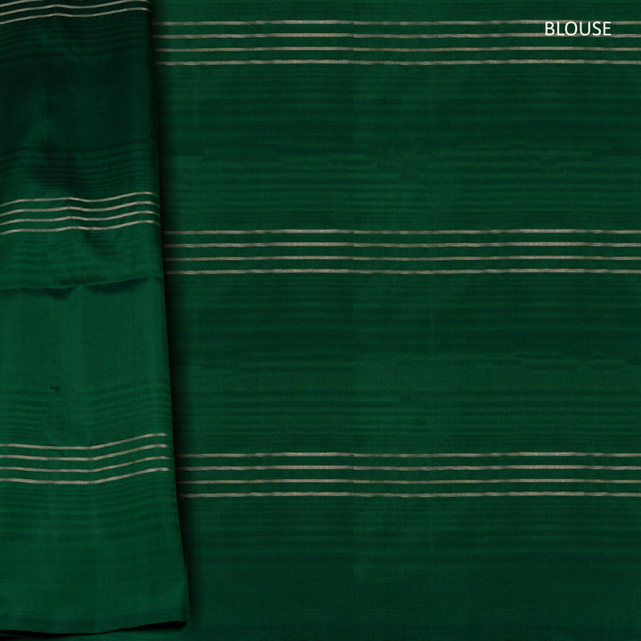 Green soft silk saree with lime yellow stripe and dash threadwork and silver zari lines, paired with a plain blouse with zari detailing.