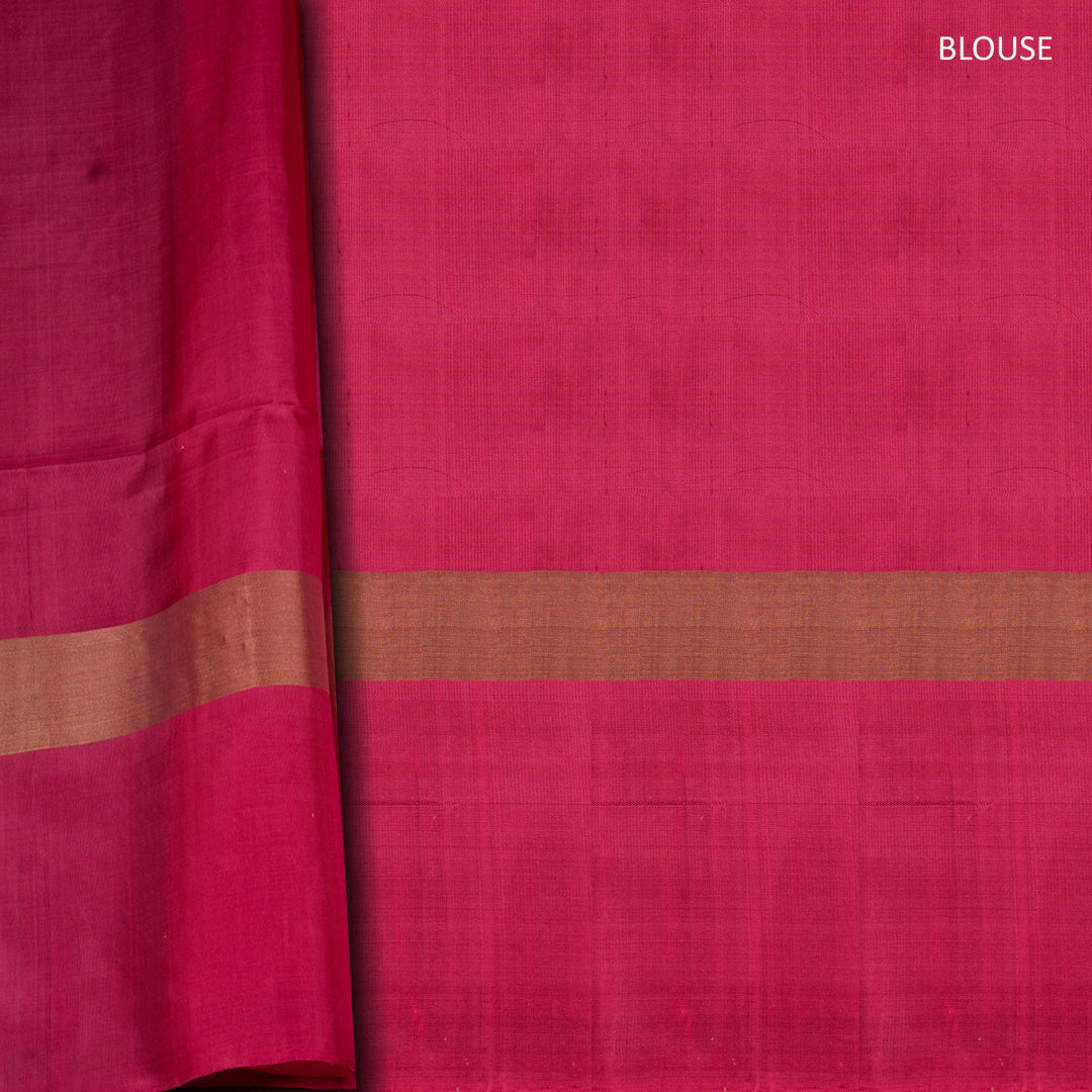 Light blue soft silk saree with silver butta allover, pink and gold zari border and pink pallu with bird and plant motifs.