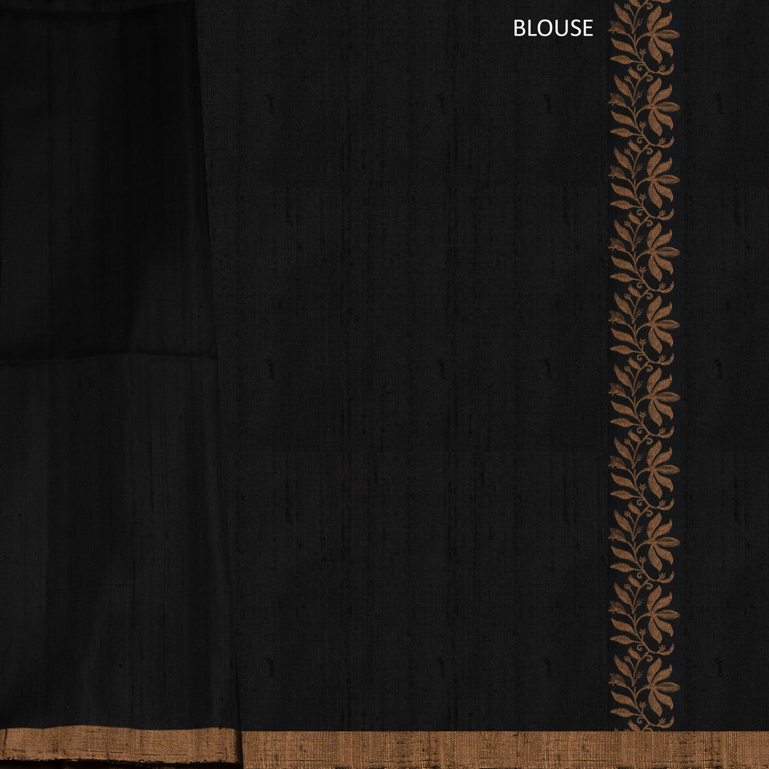 Black soft silk saree with small gold and silver zari buttas, floral border and blue contrast pallu with diamond and floral motifs.