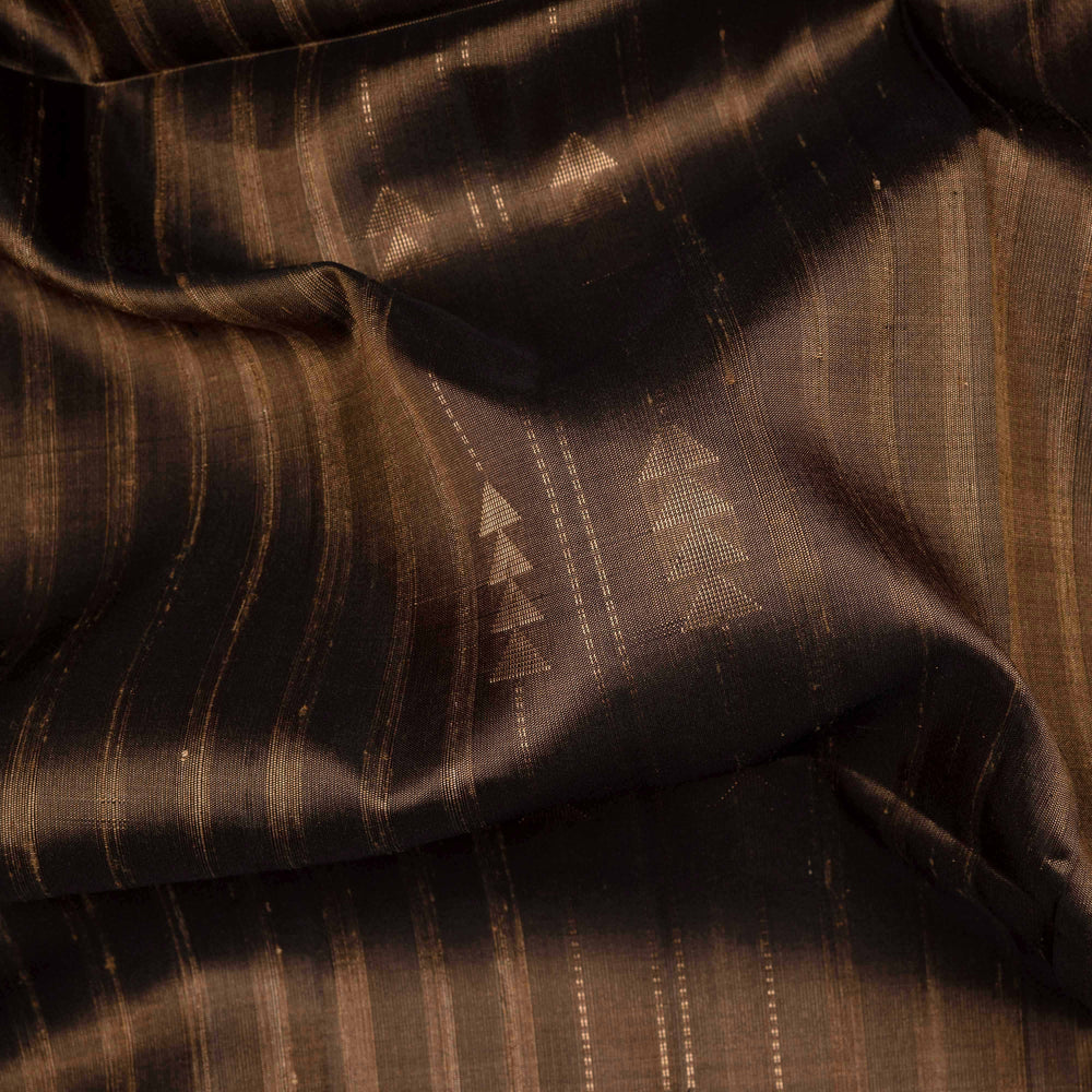 Brown soft silk saree with striped body and triangle motifs, gold tissue border and maroon black pallu with geometric patterns.