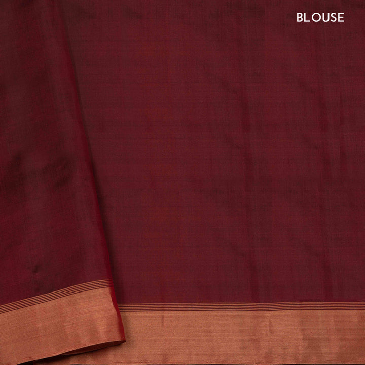 Brown soft silk saree with striped body and triangle motifs, gold tissue border and maroon black pallu with geometric patterns.