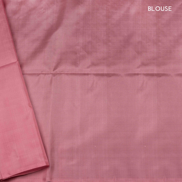 Light pink borderless soft silk saree with dotted lines, geometric square and rectangle patterns with silver zari and striped pallu.