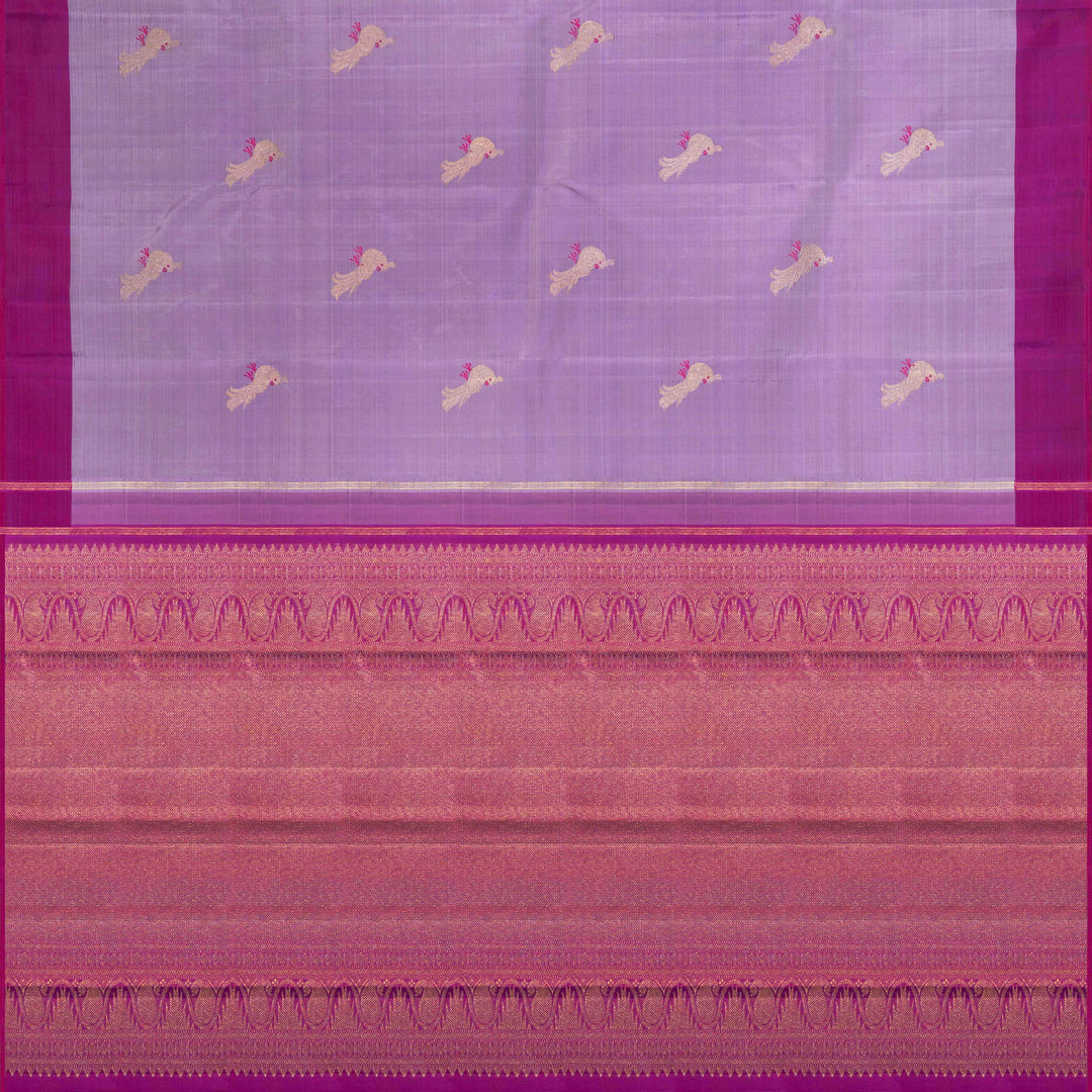 Purple handwoven Kanjivaram silk saree with meenakari parrot motifs, magenta border, detailed pallu with mango, thazampoo, and temple designs, paired with magenta blouse.
