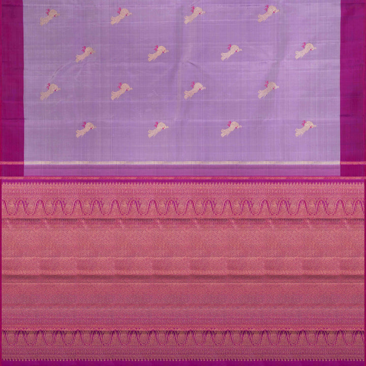 Purple handwoven Kanjivaram silk saree with meenakari parrot motifs, magenta border, detailed pallu with mango, thazampoo, and temple designs, paired with magenta blouse.