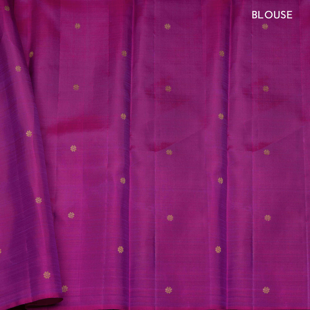 Purple handwoven Kanjivaram silk saree with meenakari parrot motifs, magenta border, detailed pallu with mango, thazampoo, and temple designs, paired with magenta blouse.