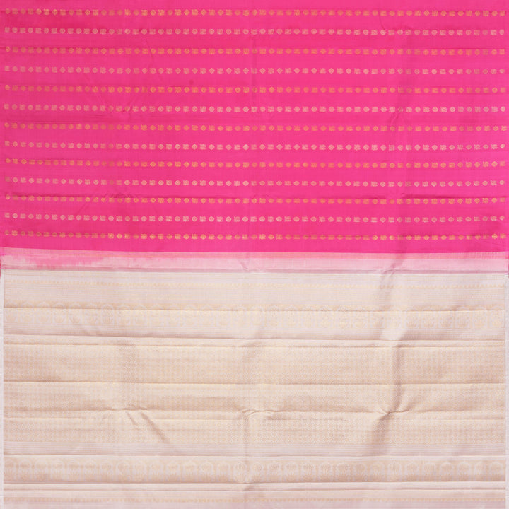 Pink handwoven Kanjivaram silk saree with vertical annam and chakram zari buttas, grey pallu with floral and traditional motifs, paired with grey blouse.