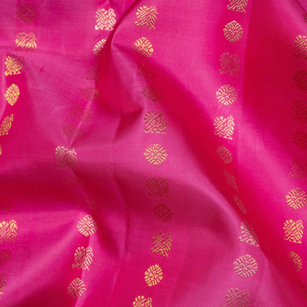 Pink handwoven Kanjivaram silk saree with vertical annam and chakram zari buttas, grey pallu with floral and traditional motifs, paired with grey blouse.