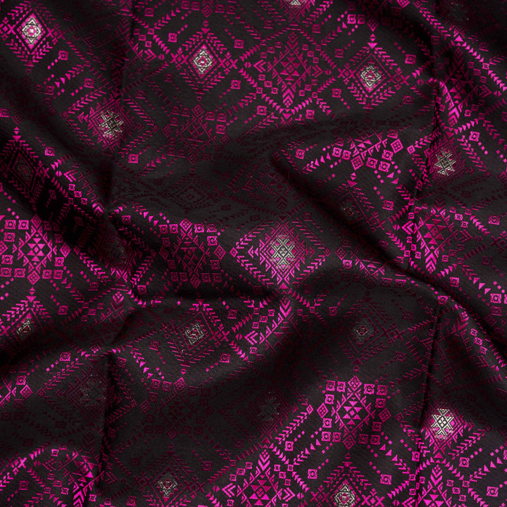 Black handwoven Kanjivaram silk saree with pink thread work, diamond and star zari motifs, peach floral meenakari border, and matching pallu, paired with peach blouse.