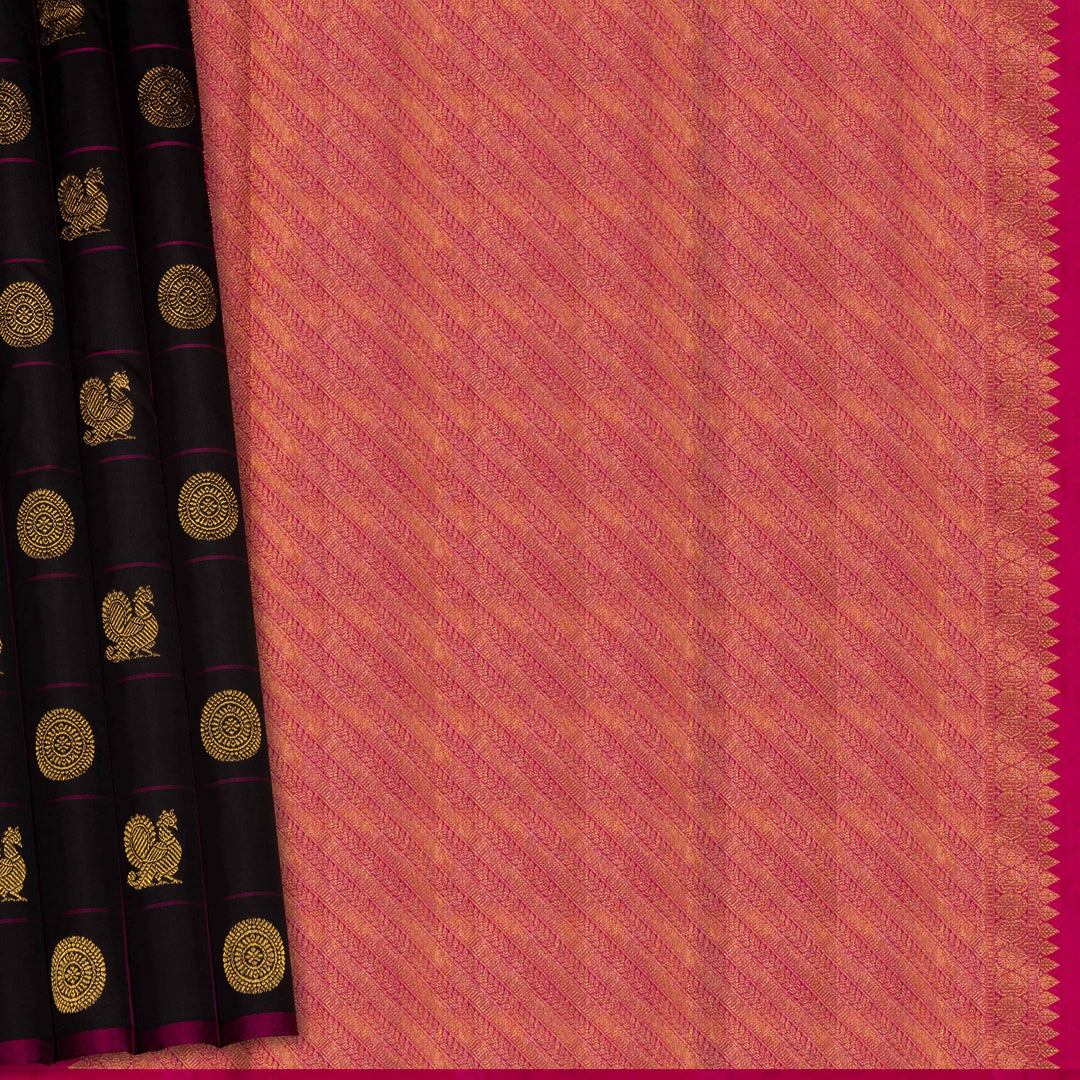 Black handwoven Kanjivaram silk saree with magenta checks, annam and chakram motifs, and pink pallu with gold zari chevron and leaf designs, paired with magenta blouse.