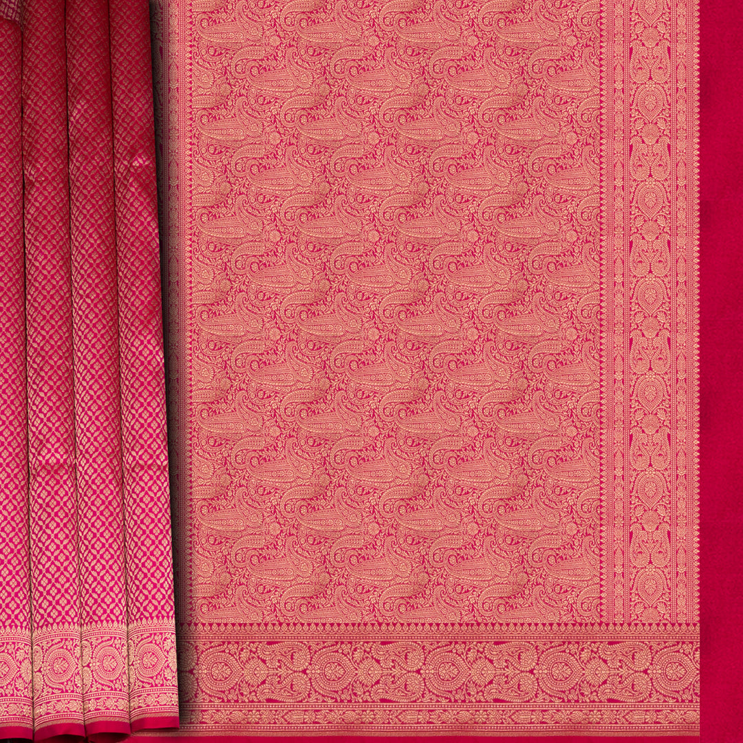 Pink Banarasi silk saree with gold brocade, diamond and vaira mookuthi buttas, paisley border with dotted and malli moggu design and matching pallu.