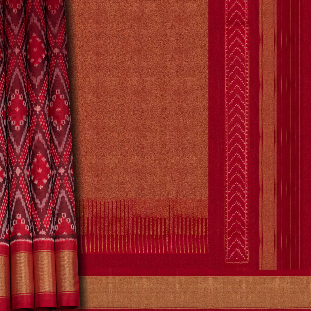 Red Pochampally Ikat silk saree with diamond motifs, red and gold zari border, and temple design pallu with arrow patterns, paired with plain red blouse with zari border.