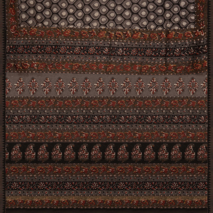 Grey handwoven Chanderi silk saree with Ajrakh print, gicha temple border, floral pallu design, paired with grey blouse with floral vines.