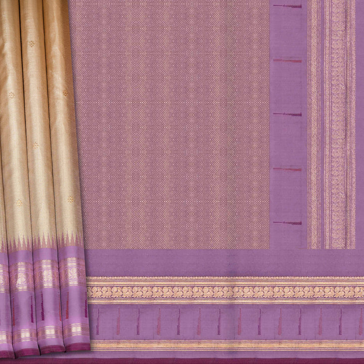 Cream Kanjivaram silk saree with tissue body, silver zari floral butta, lavender Paithani border and annam design pallu with matching blouse